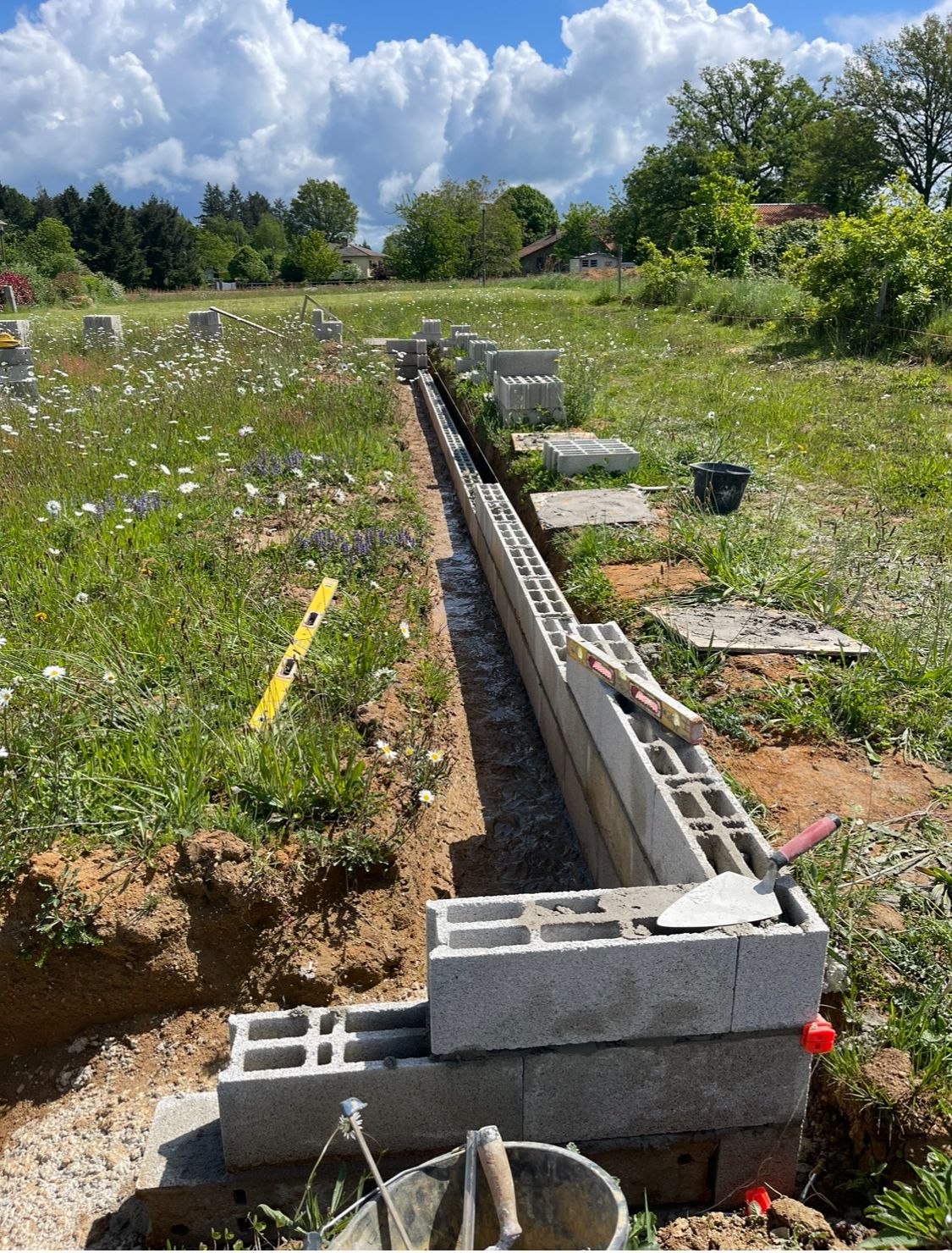 Block foundation in a rural field setting