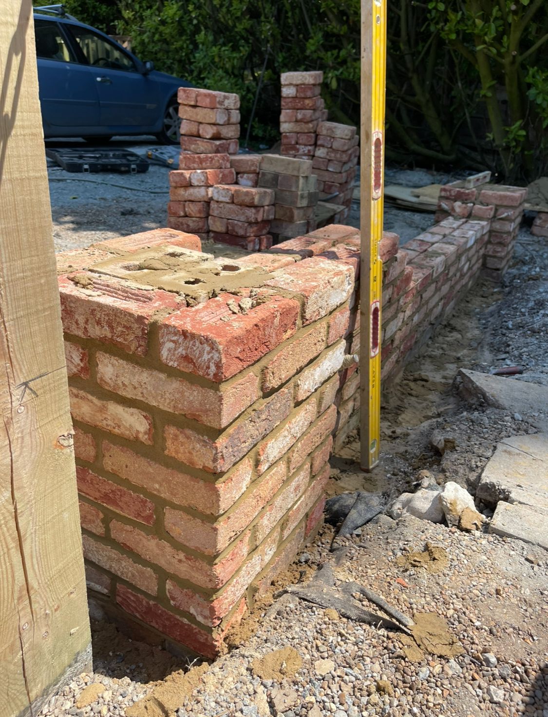 Brick pier being checked with spirit level