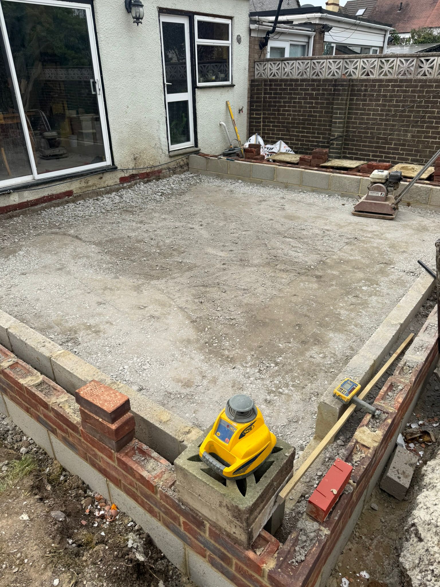 Extension oversite slab with laser level setup