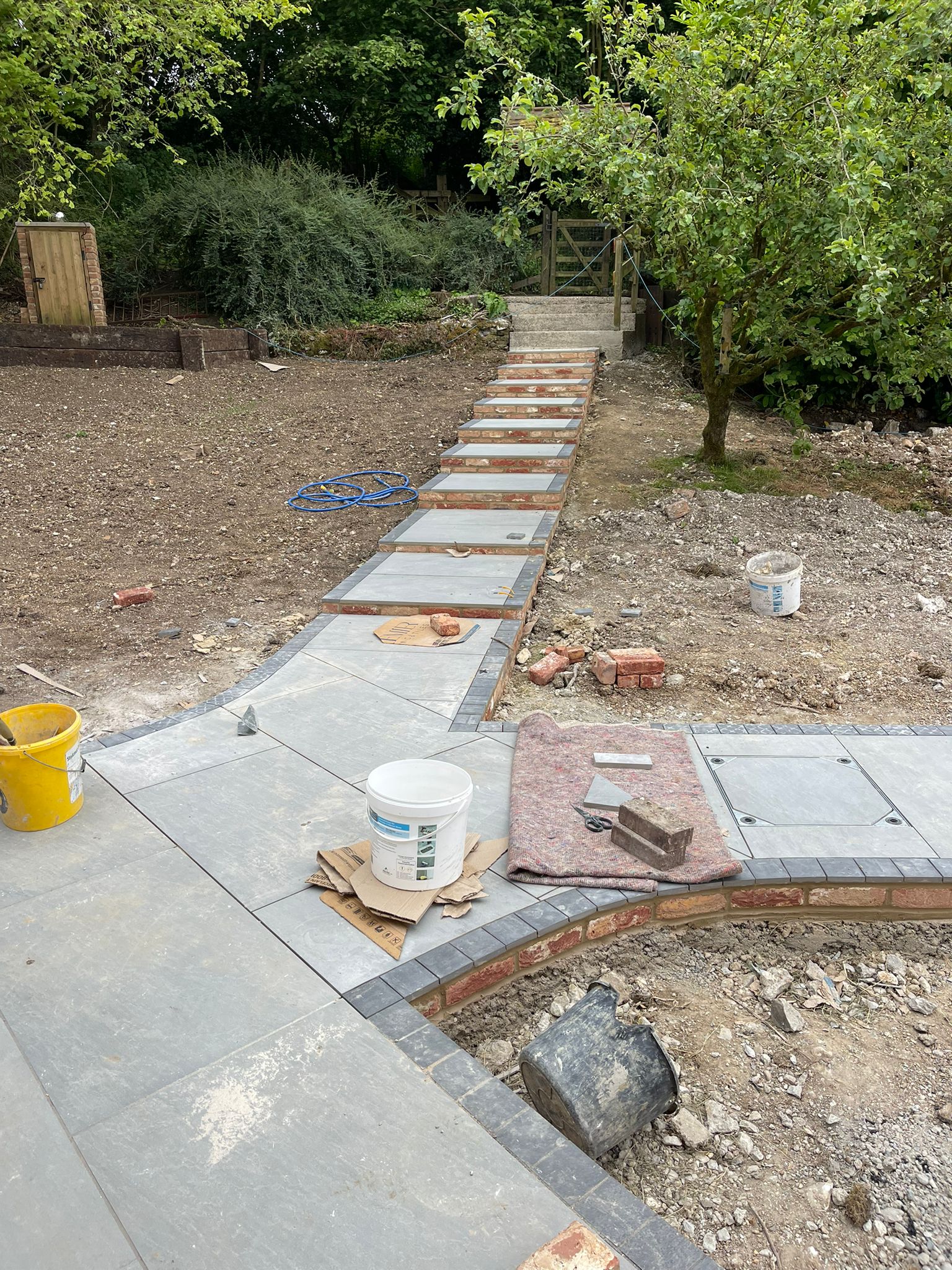Curved patio and stepping stone path overview