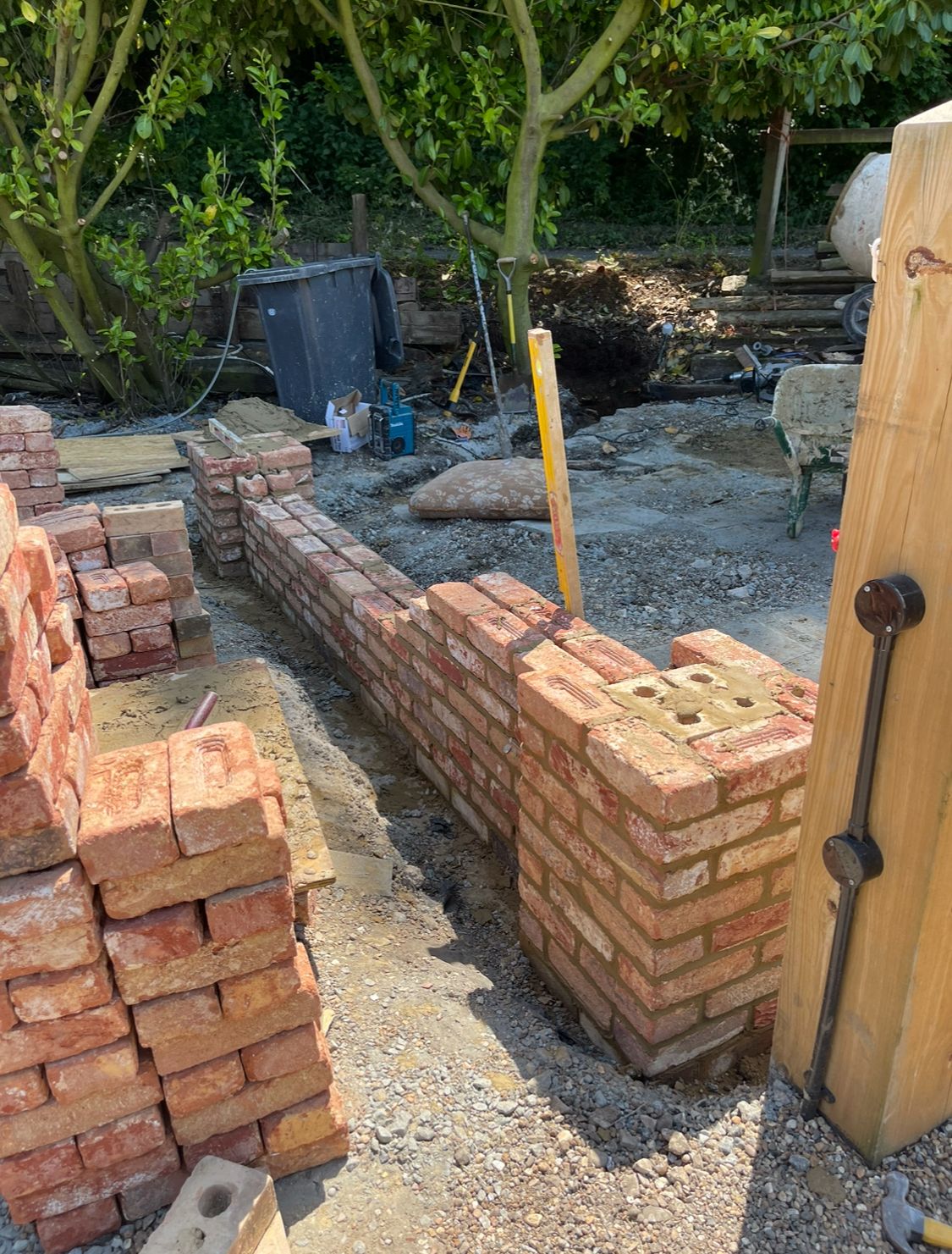 Garden wall with brick gate pier