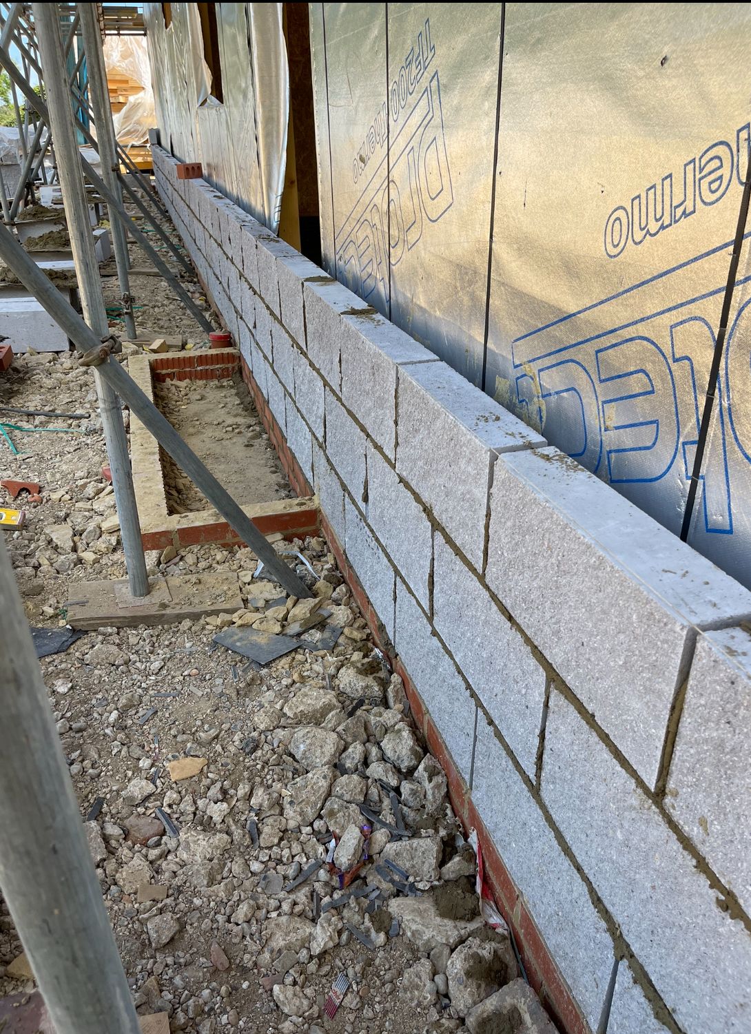New build block outer skin base course with insulation