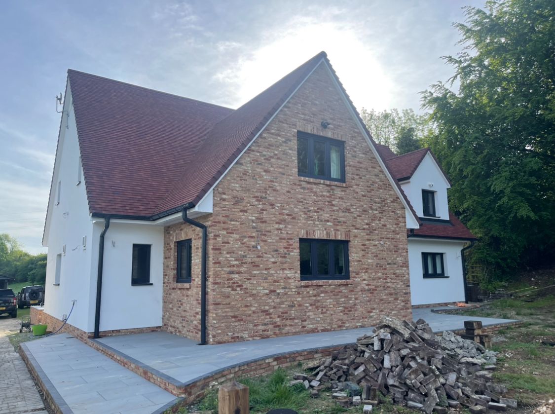 Completed new build house with reclaimed brick feature gable in Kent