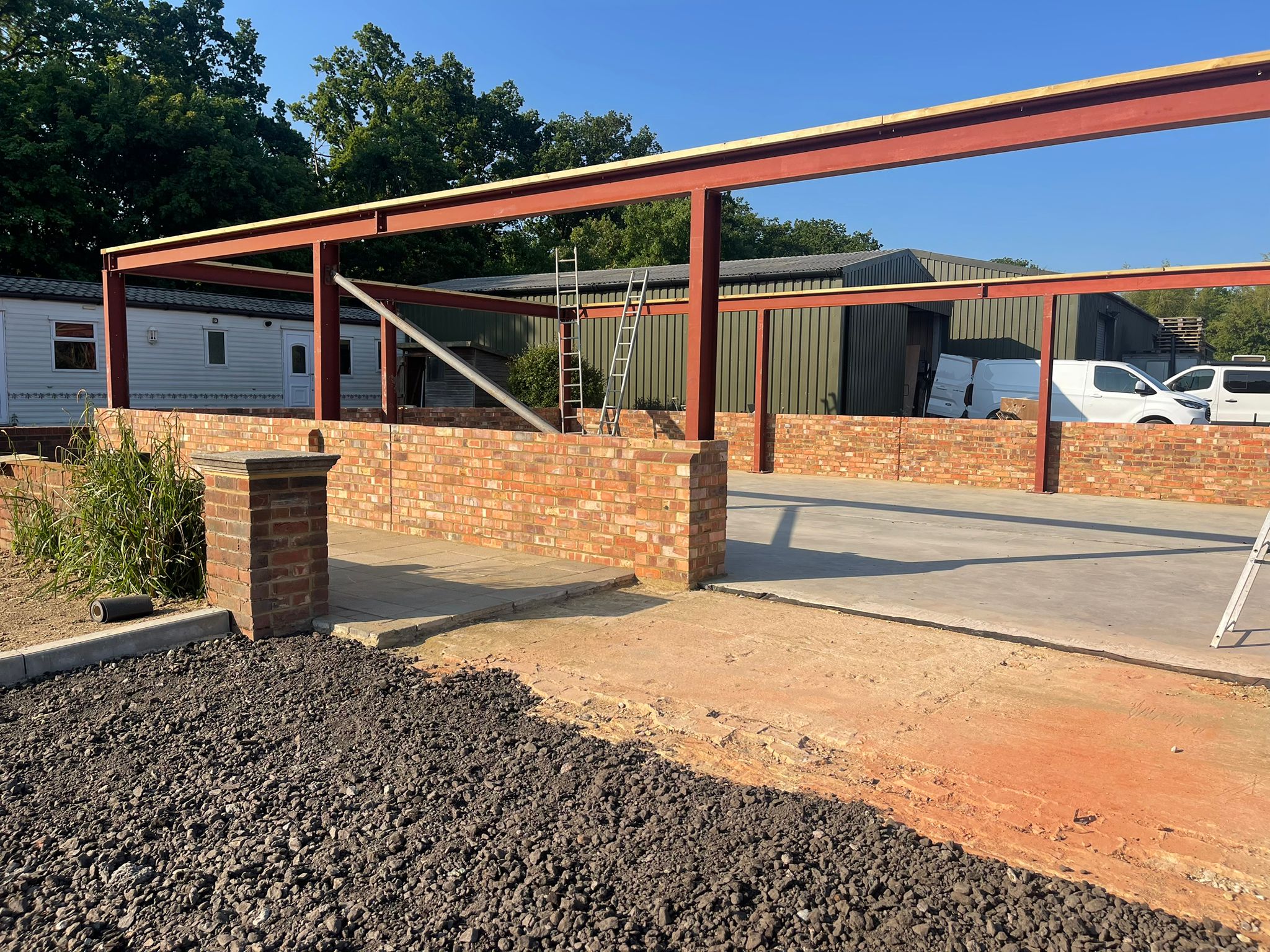 Steel-framed pavilion with brick dwarf walls