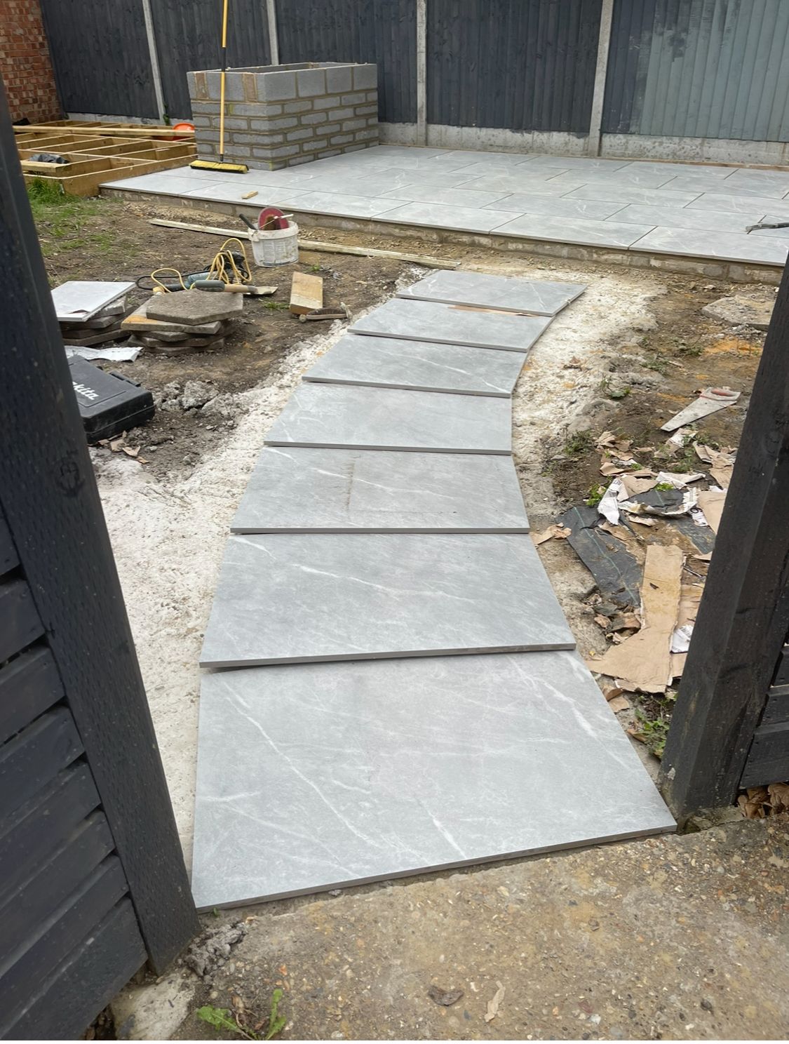 Curved porcelain garden path in progress