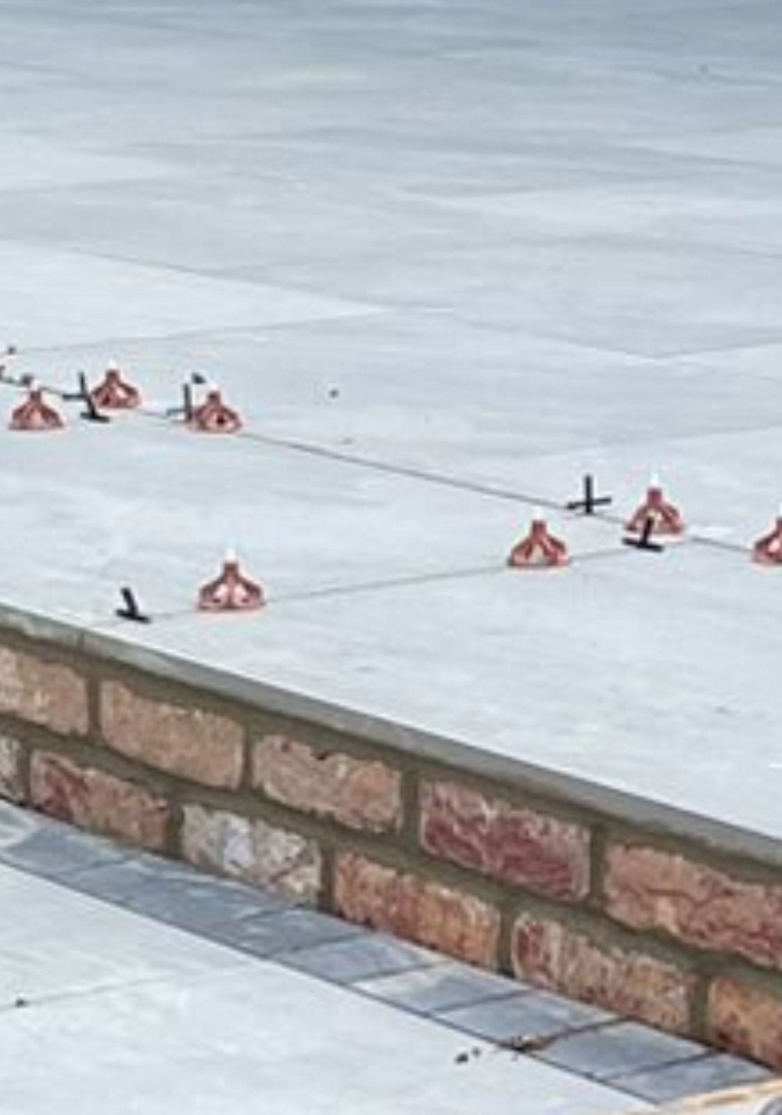 Porcelain tile spacer clips showing precision tiling