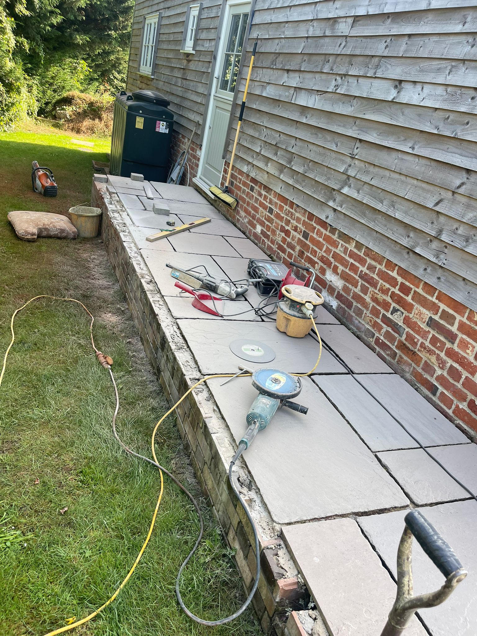 Side patio alongside a weatherboard building