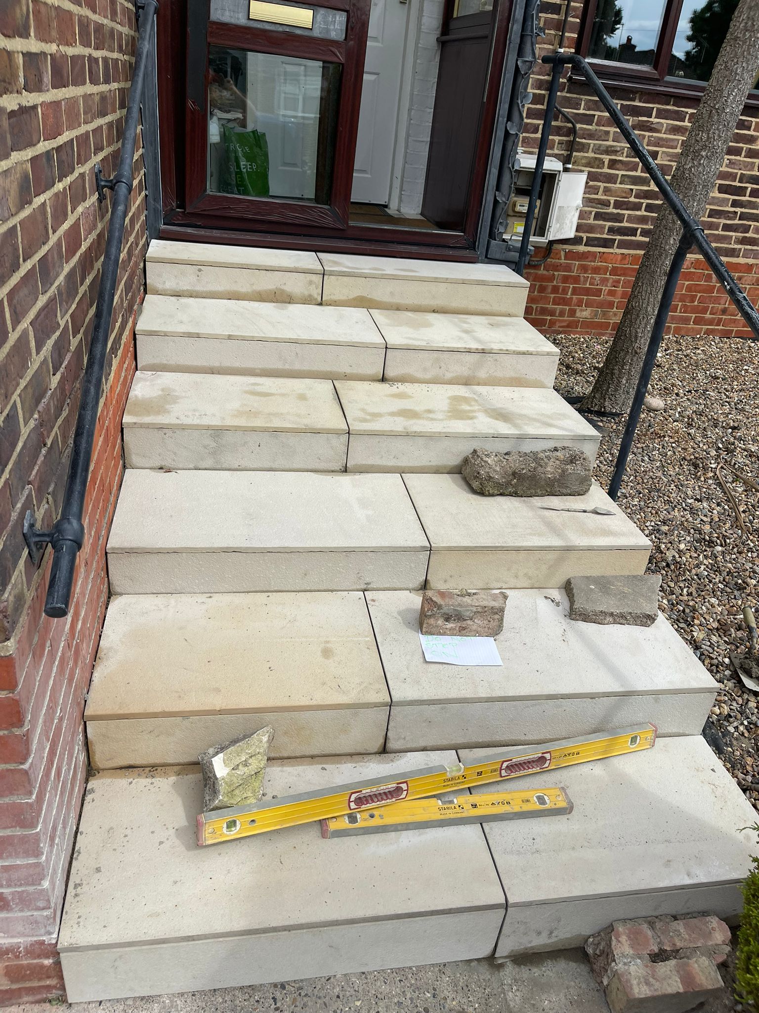 Stone front door steps under construction